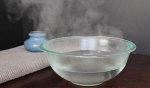 Steam Inhalation to Clear the Airways bowl of boiled water