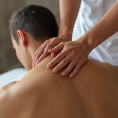 Person applying pressure to shoulder or upper back