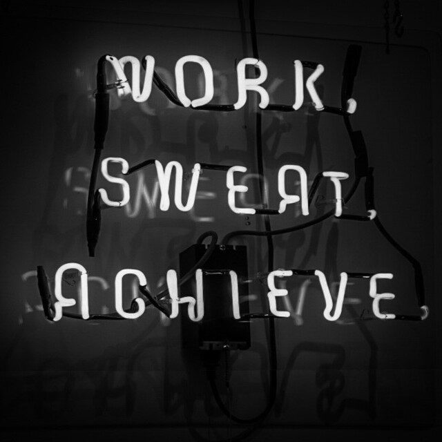 Lights that say work, sweat, acheive - Making consistent progress toward goals through small daily actions