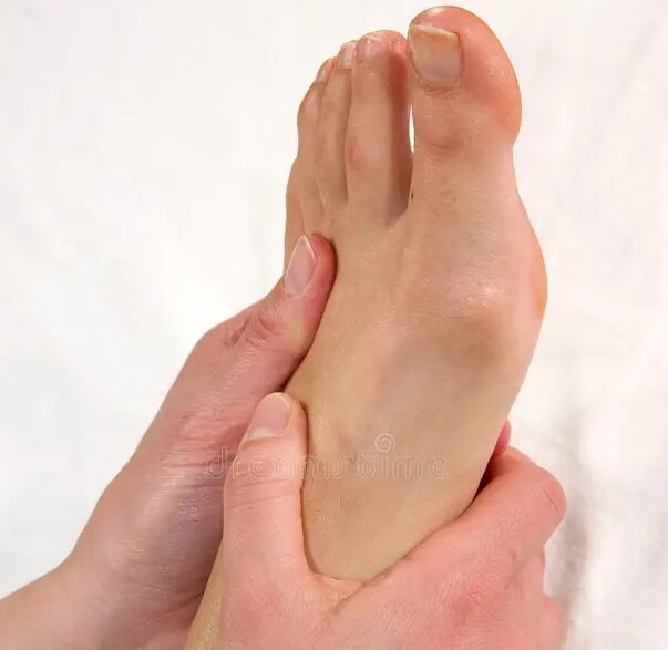 Close-up of thumb pressure on foot arch
