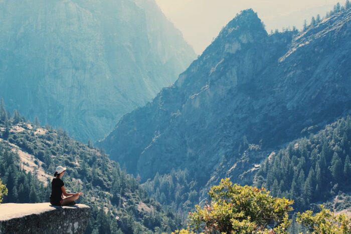 Image of a person meditating, representing relaxation techniques for managing IBD pain.