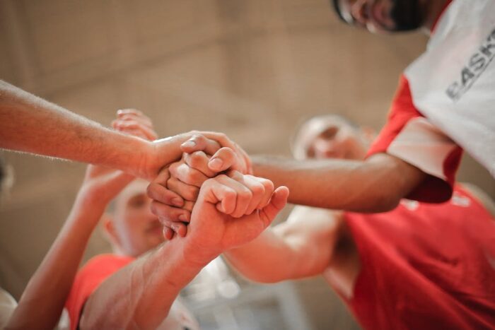 A group of people sitting in a circle, engaging in a support group for Inflammatory Bowel Disease. 