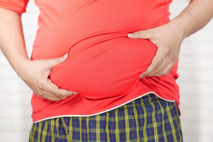 Illustration of a person experiencing bloating