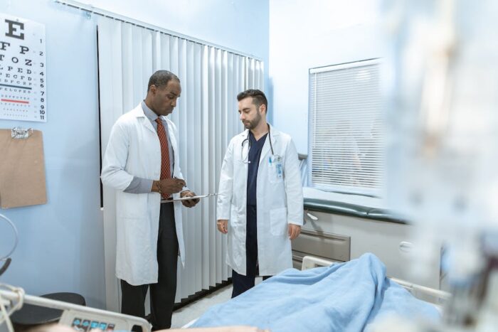 Illustration showing a doctor and an elderly patient discussing IBD, representing the importance of understanding and managing the disease in older adults.